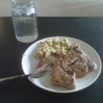 Pork chops, scrambled eggs, and water