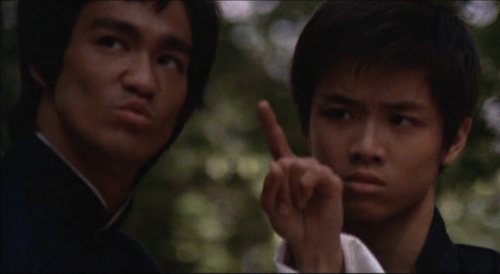 Scene from "Enter the Dragon" where Bruce Lee instructs a young student to not on the finger pointing at the moon but at the moon itself