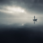 Small rowboat out at sea