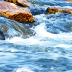 River flowing over rocks to represent mental flow state