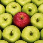 One red apple among many green apples