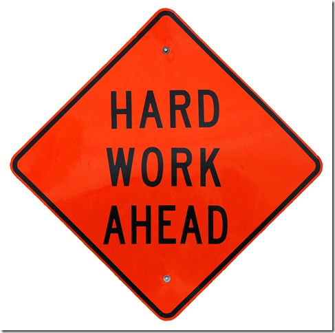 A sign that says Hard Work Ahead