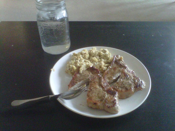 Pork chops, scrambled eggs and water in a jar