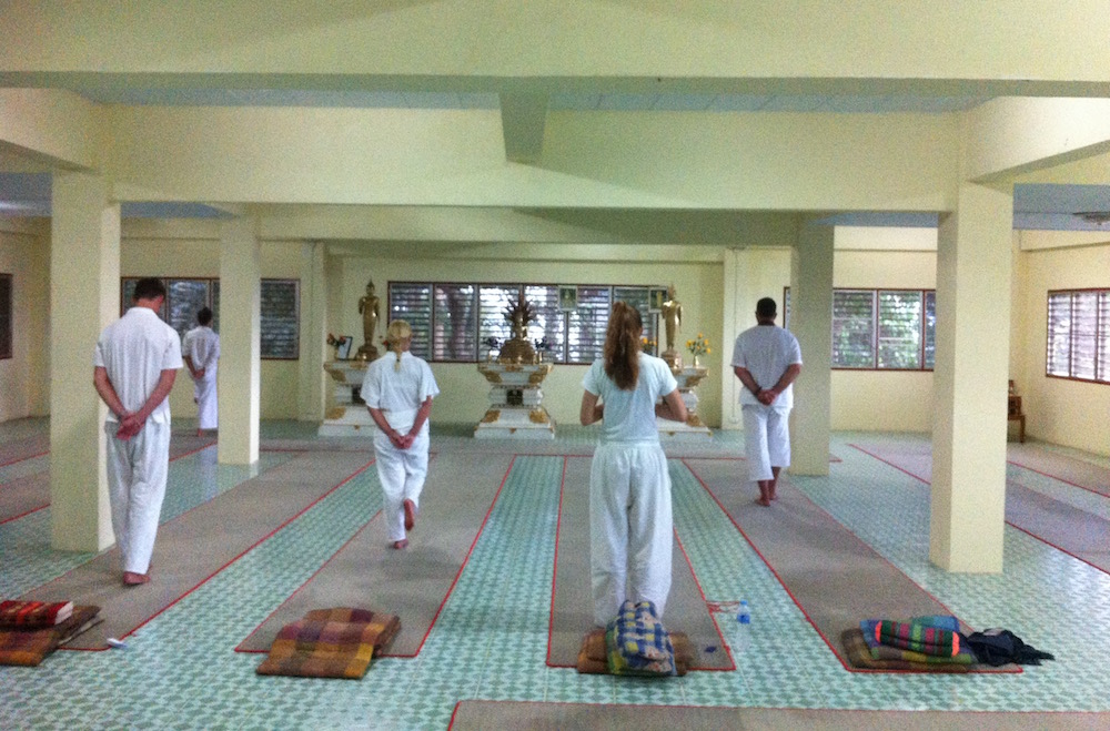 Group practicing walking meditation at Doi Suthep Temple in Chiang Mai, Thailand