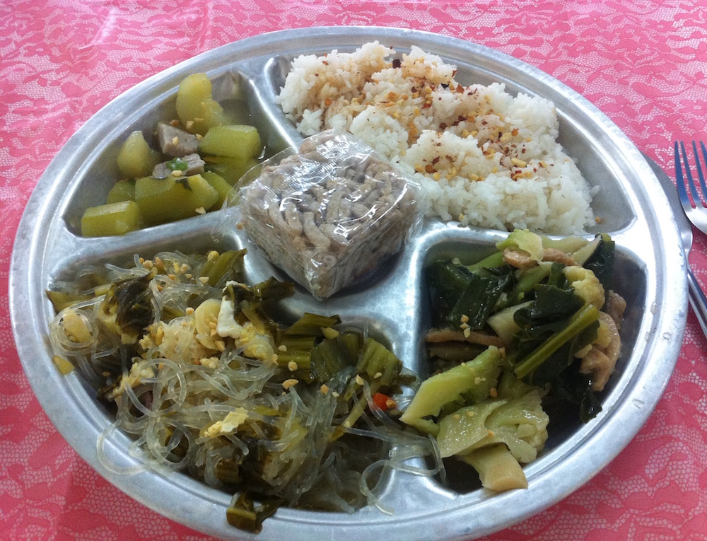 Rice and vegetables for lunch at a vipassana silent meditation retreat at Doi Suthep Buddhist temple in Chiang Mai, Thailand