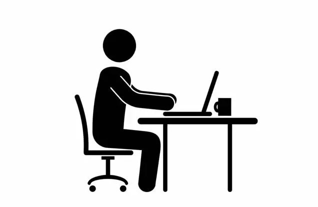 A stick figure sitting at a table working on his laptop with a coffee mug (probably an introvert and INTJ)