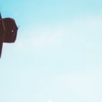 Academic hat being thrown in the air